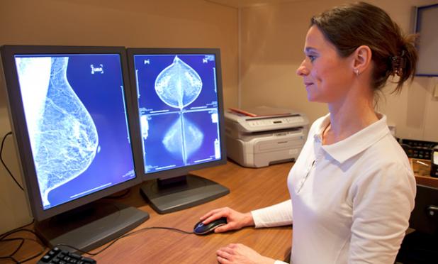 Woman looking at breast cancer scans